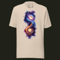 Abstract Galaxy unisex t-shirt in soft cream featuring two glowing abstract galaxies connected by flowing blue and orange energy.