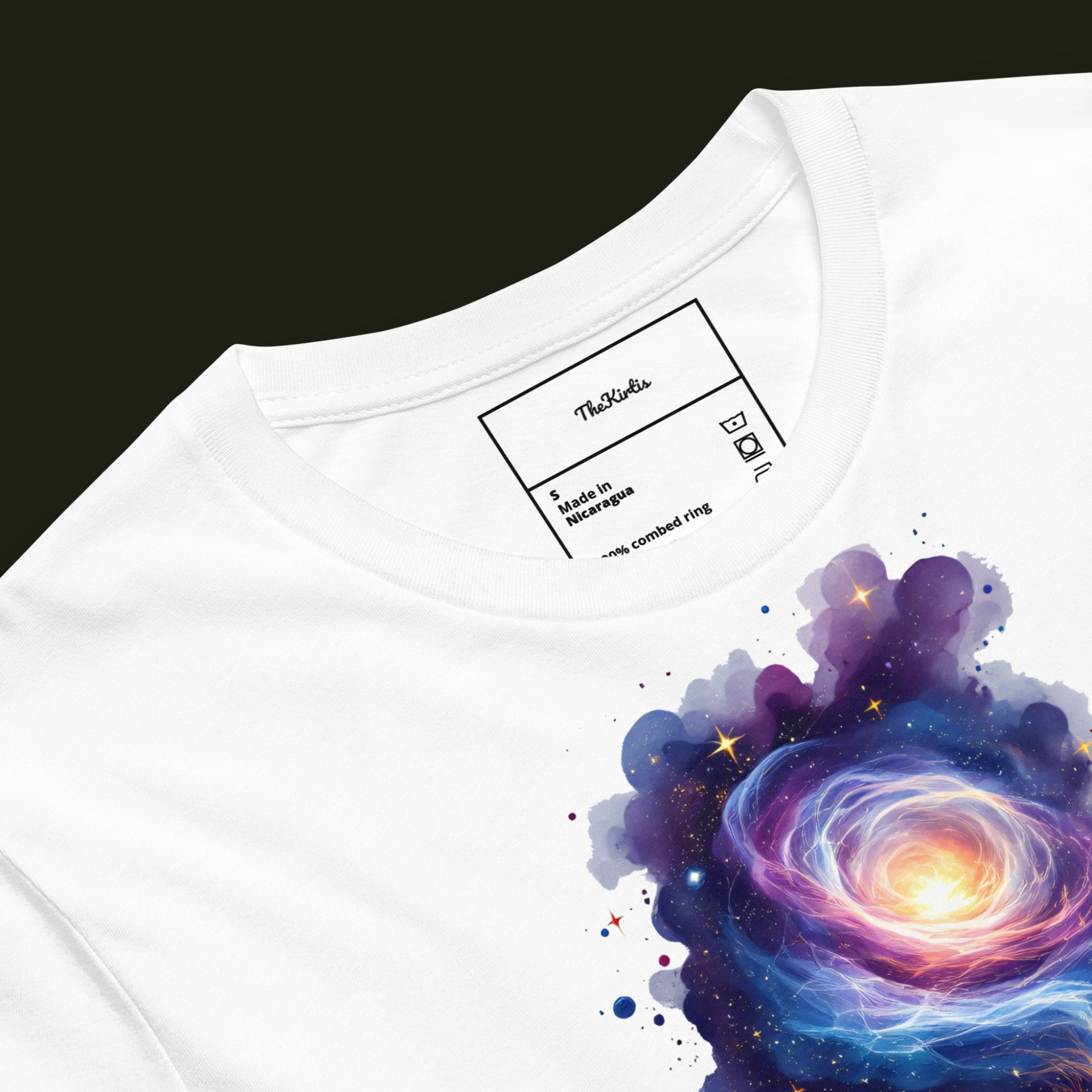 Close-up of the Abstract Galaxy artwork on a white unisex t-shirt showing the upper glowing galaxy and surrounding purple nebula clouds.