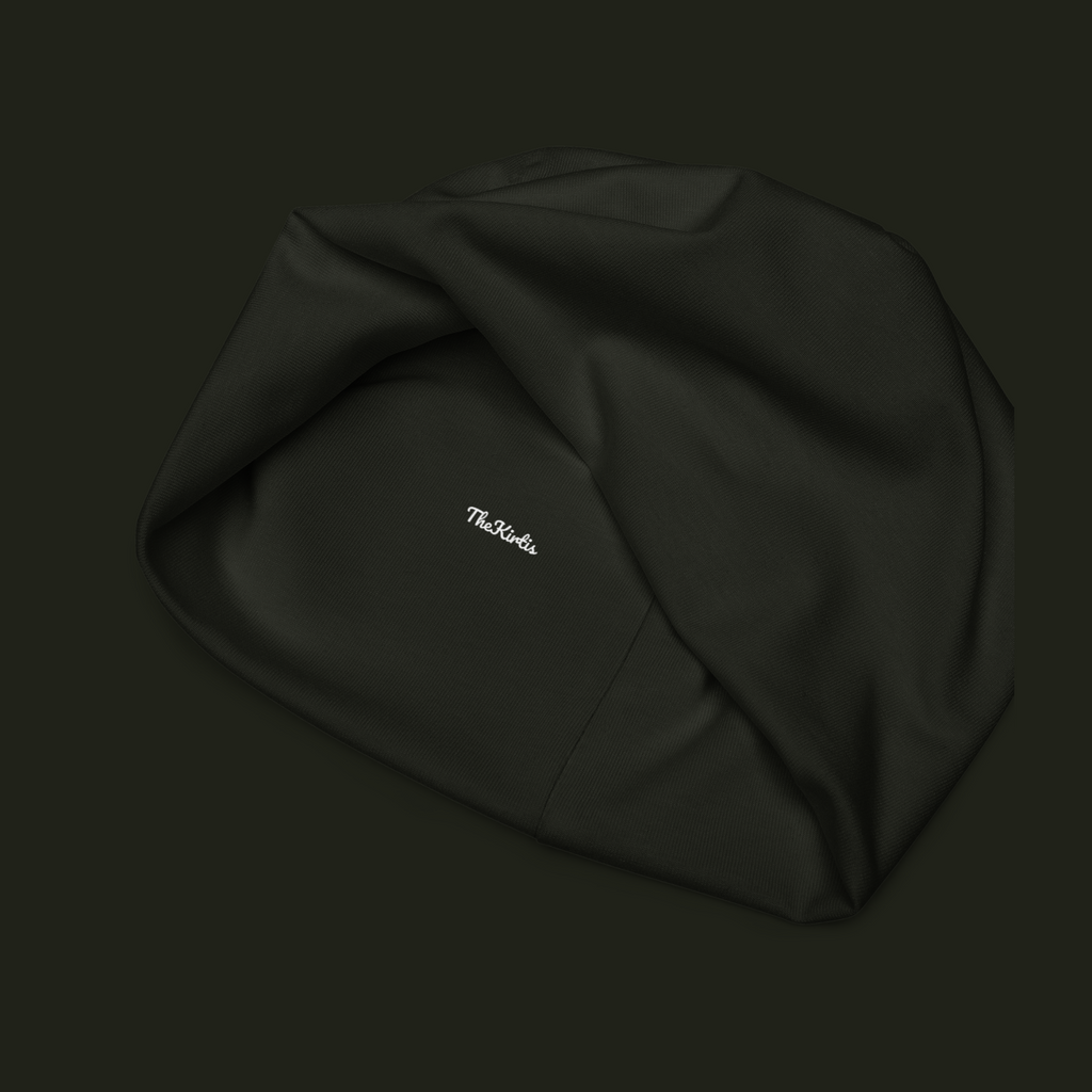 Inside view of the Dornavyn unisex beanie showing the TheKirtis label, dark fabric texture and interior seam construction.