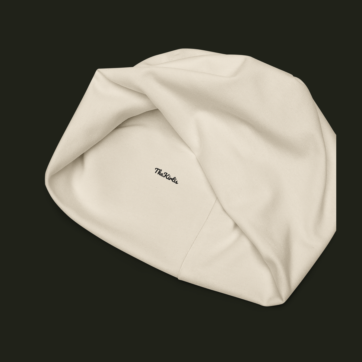 Inside view of the Elqavyn unisex beanie showing the TheKirtis label, fabric texture and interior seam construction.