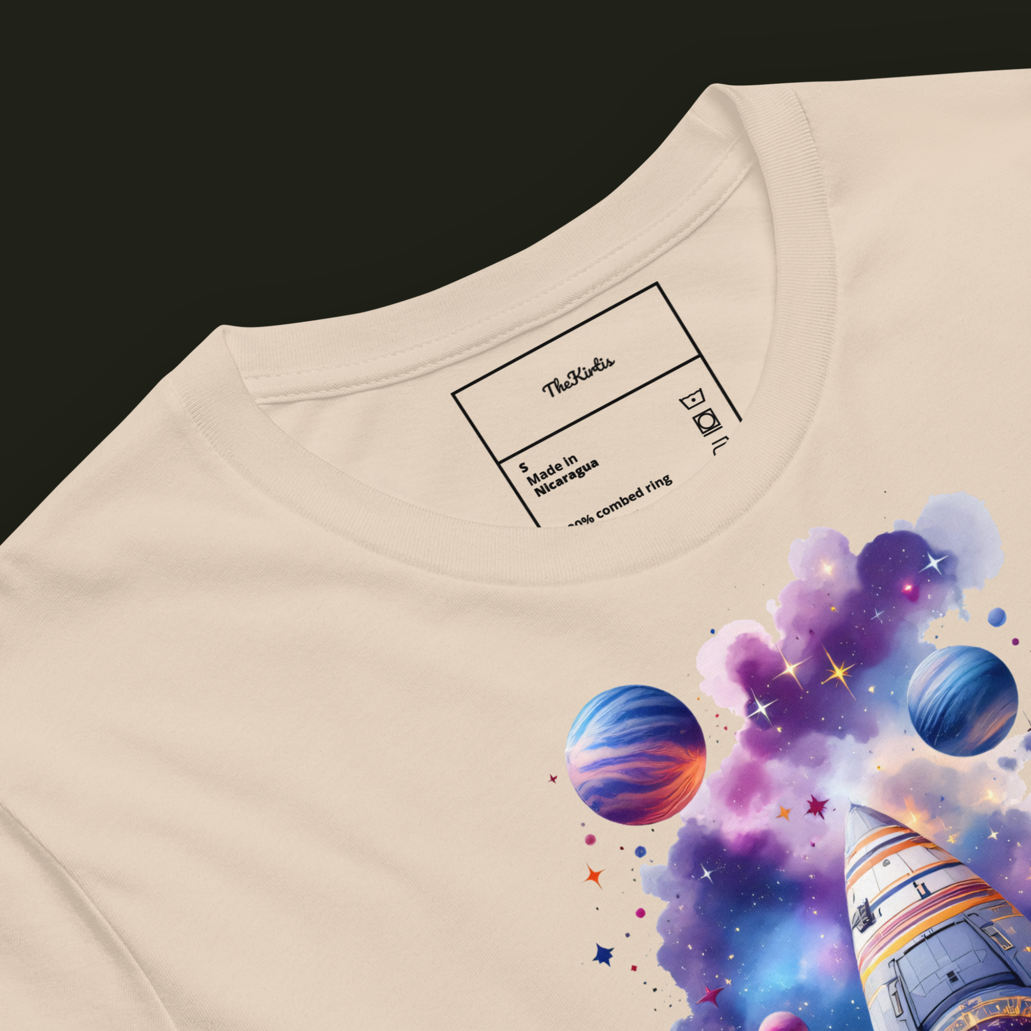 Close-up of the Eternal Voyage artwork on a soft cream unisex t-shirt showing the spacecraft, stars and nearby planets.