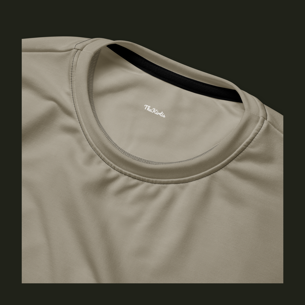 Close-up of the Lumeriqen recycled sweatshirt neckline in soft stone-beige, showing the crew neck stitching and TheKirtis inner neck print.