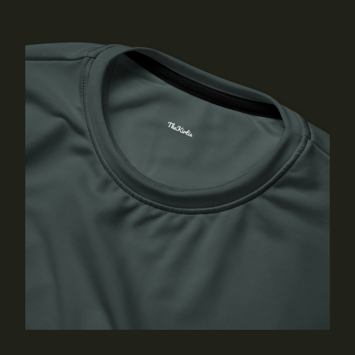 Close-up of the Orenvyr recycled sweatshirt neckline in deep muted teal, showing the crew neck stitching and TheKirtis inner neck print.