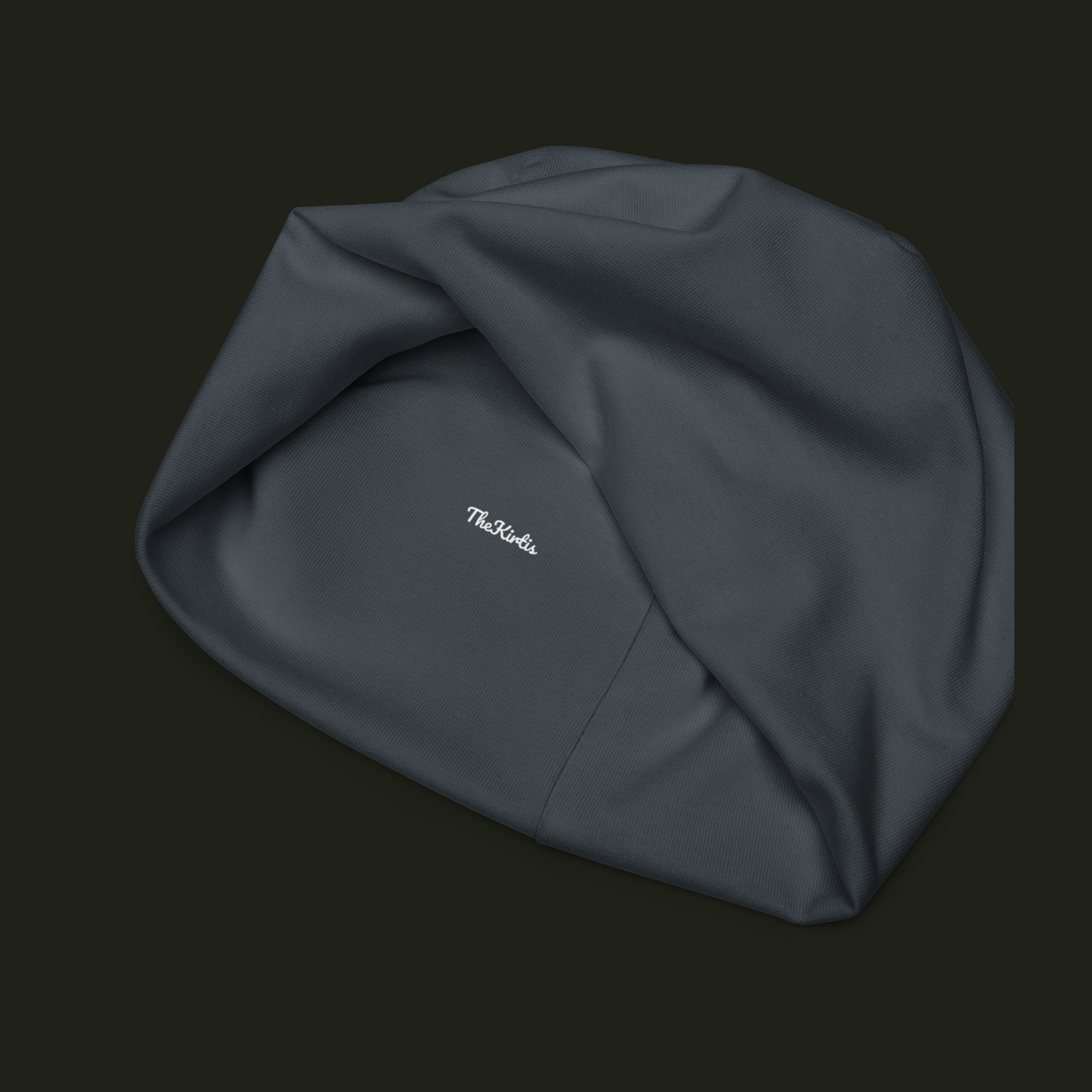 Inside view of the Orvelqen unisex beanie showing the TheKirtis label, slate blue-grey fabric texture and interior seam construction.