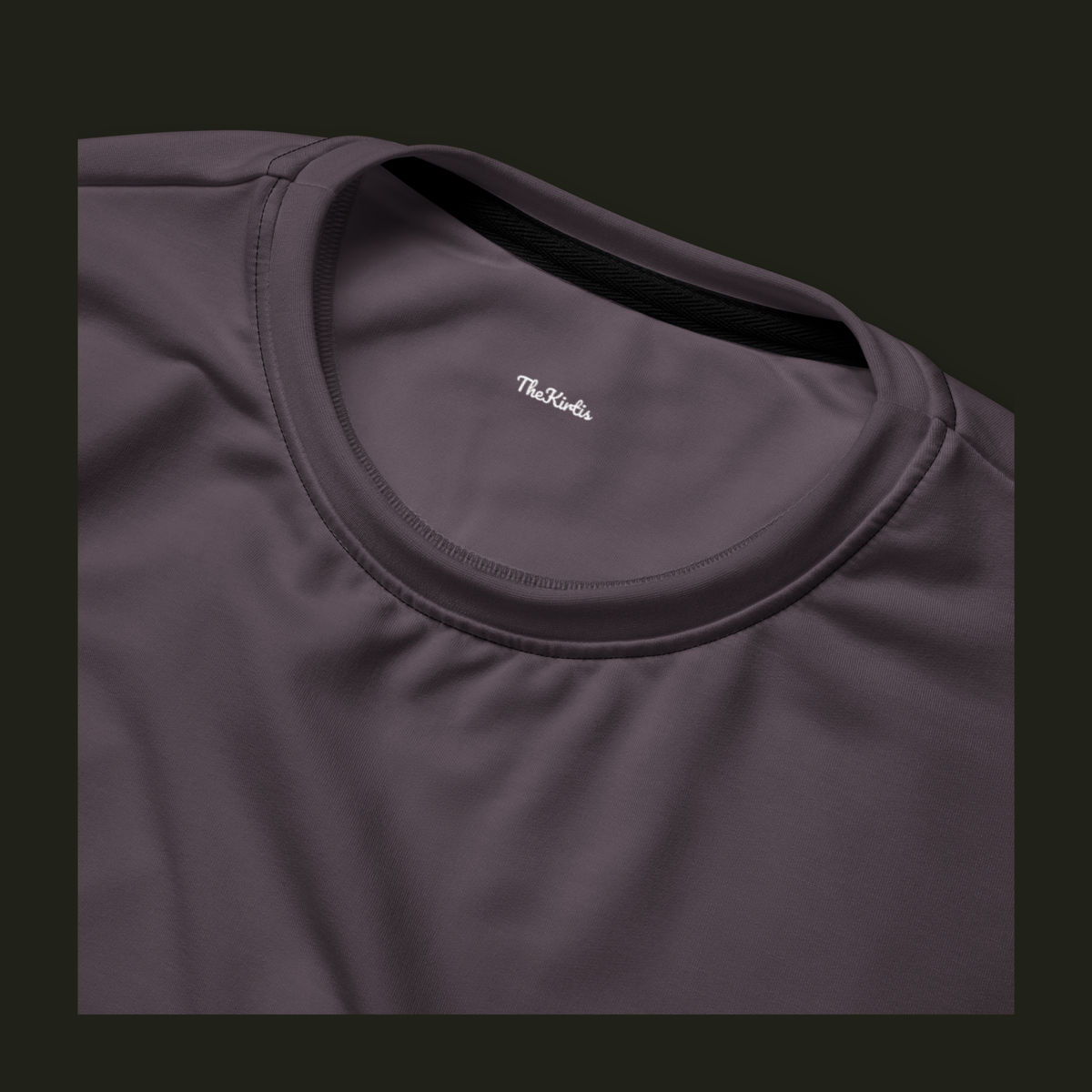 Close-up of the Sermavyn recycled sweatshirt neckline in muted plum-grey, showing the crew neck stitching and TheKirtis inner neck print.