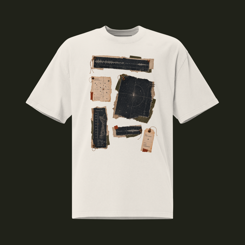 Faded Bone unisex oversized graphic T-shirt featuring the Silent Transmission cosmic patchwork design with signal waveforms, a star map and transmission charts.