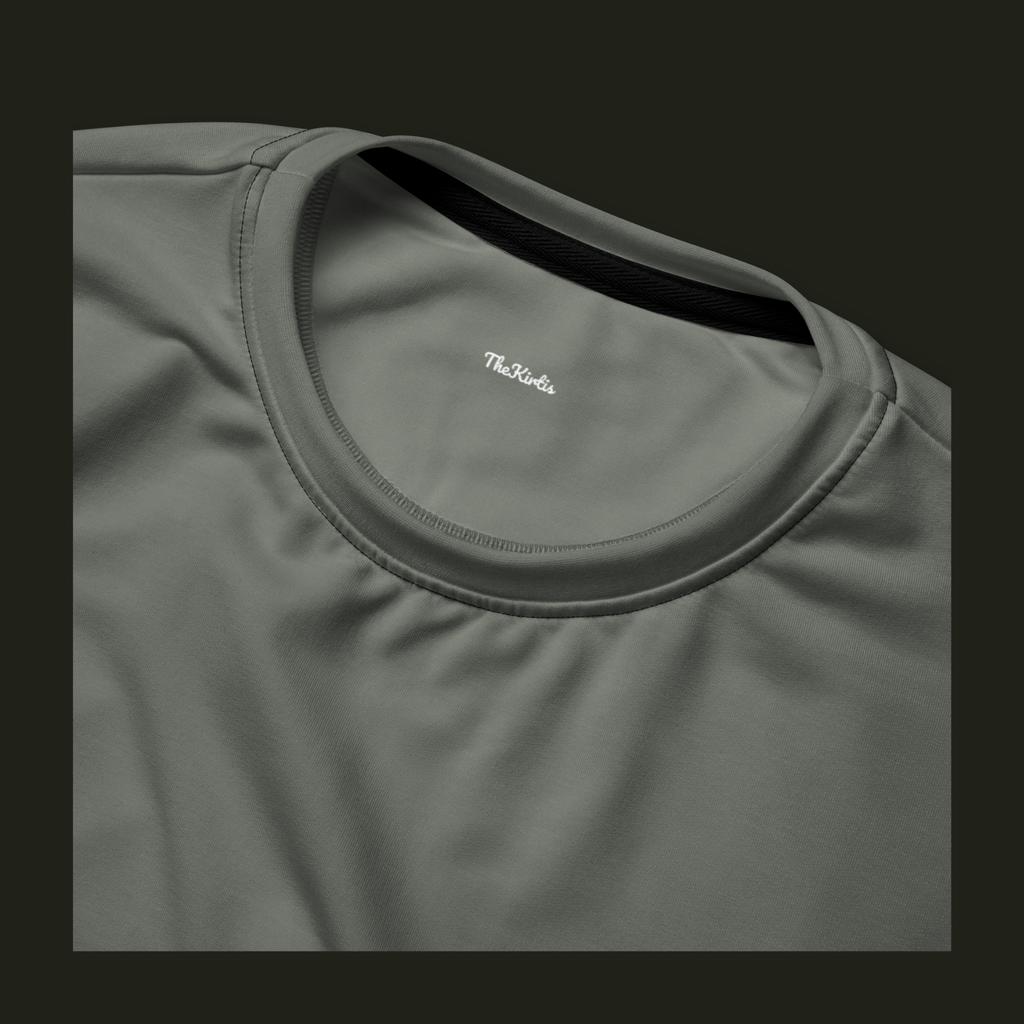 Close-up of the Talyvess recycled sweatshirt neckline in soft olive-grey, showing the crew neck stitching and TheKirtis inner neck print.