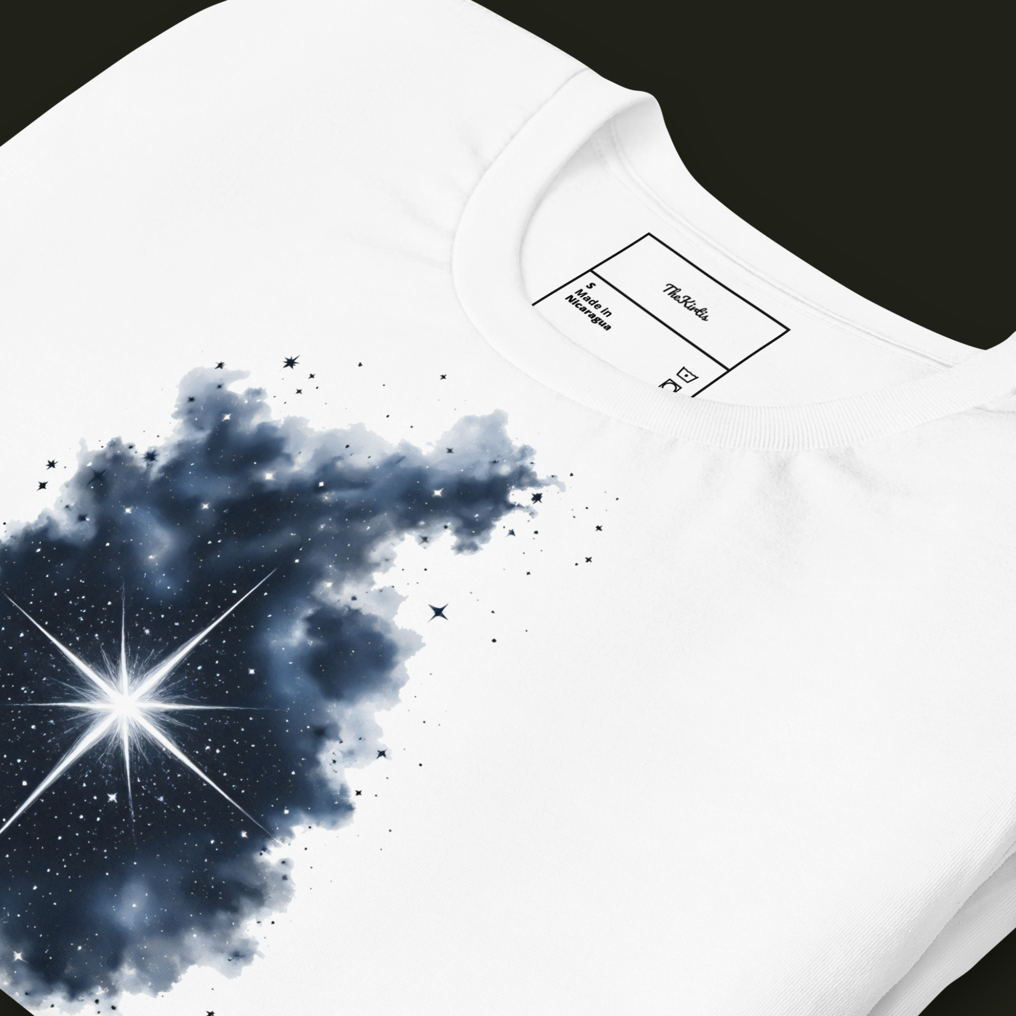 Close-up of the Within the Darkness artwork on a white unisex t-shirt highlighting the dark nebula texture and scattered stars.